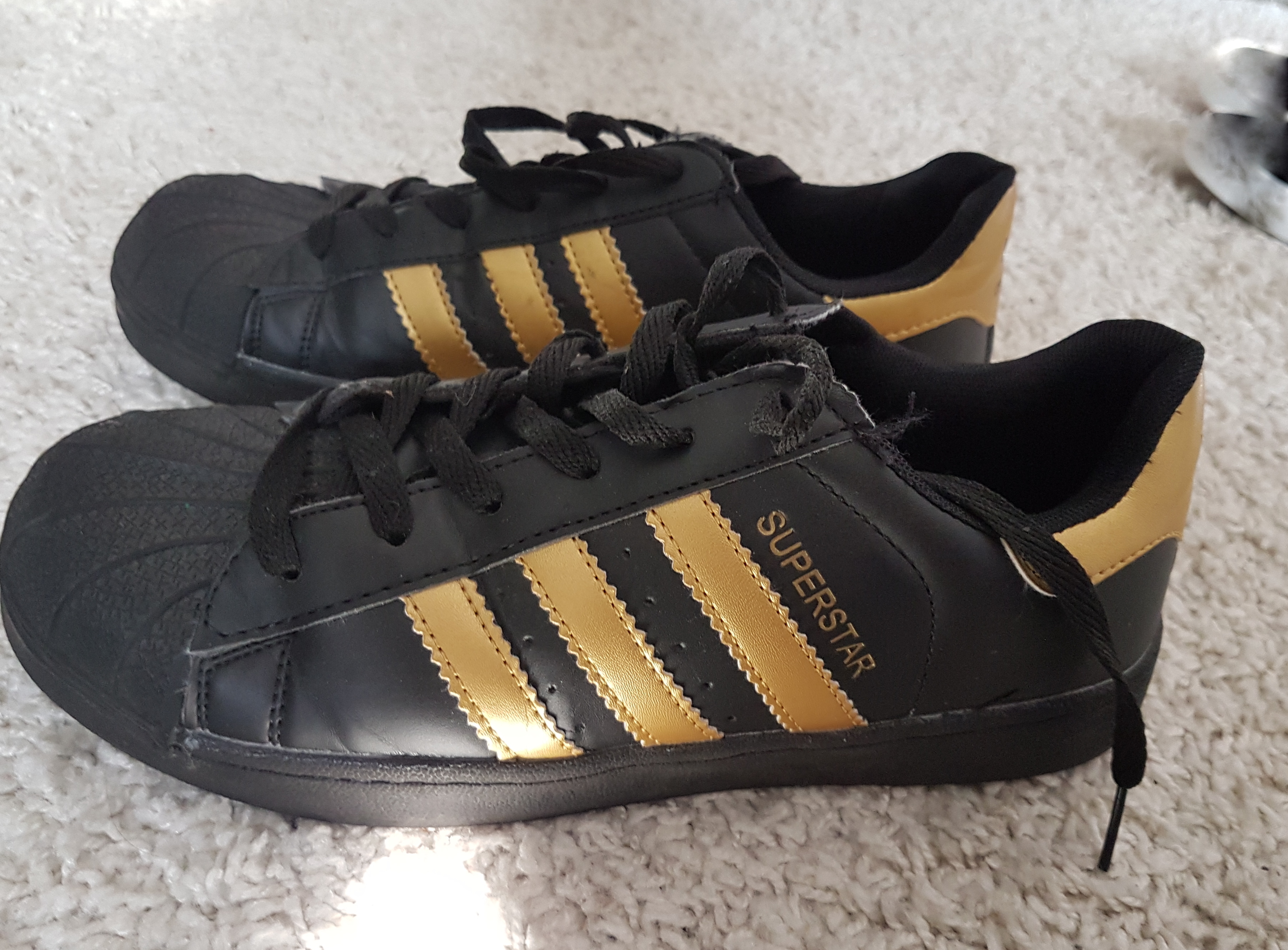 Zwarte/goud adidas superstarr schoenen 39 | Bokt.nl